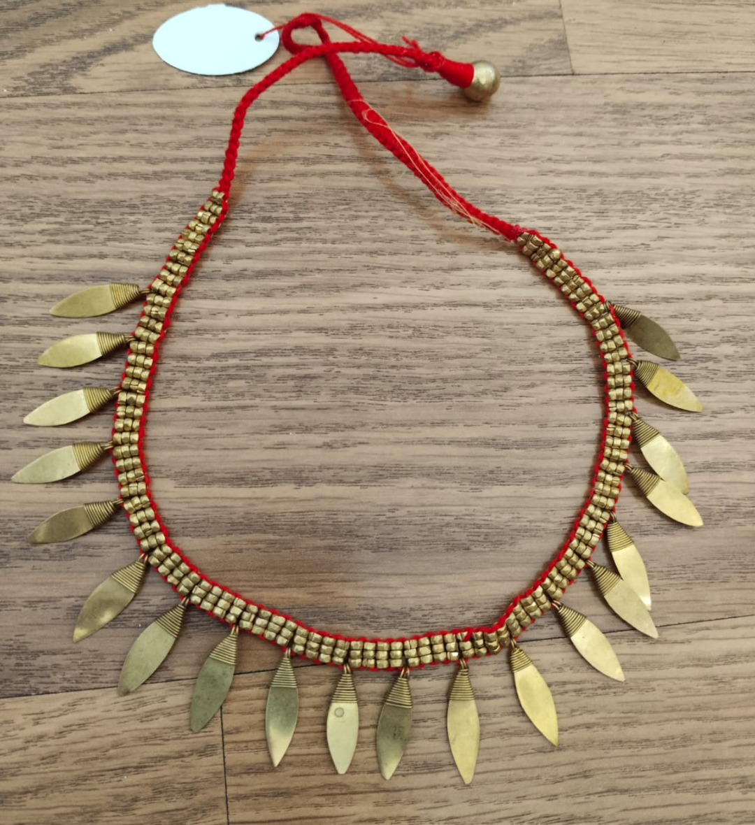 Advaita Handicrafts Ethnic Collection - Brass Dhokra Diamond-Shaped Leaf Necklace with Red Thread.