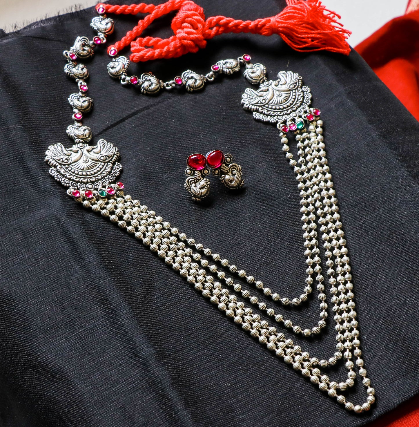 Advaita handicrafts long haram Laxmi flower peacock pendant set - click to view designs.