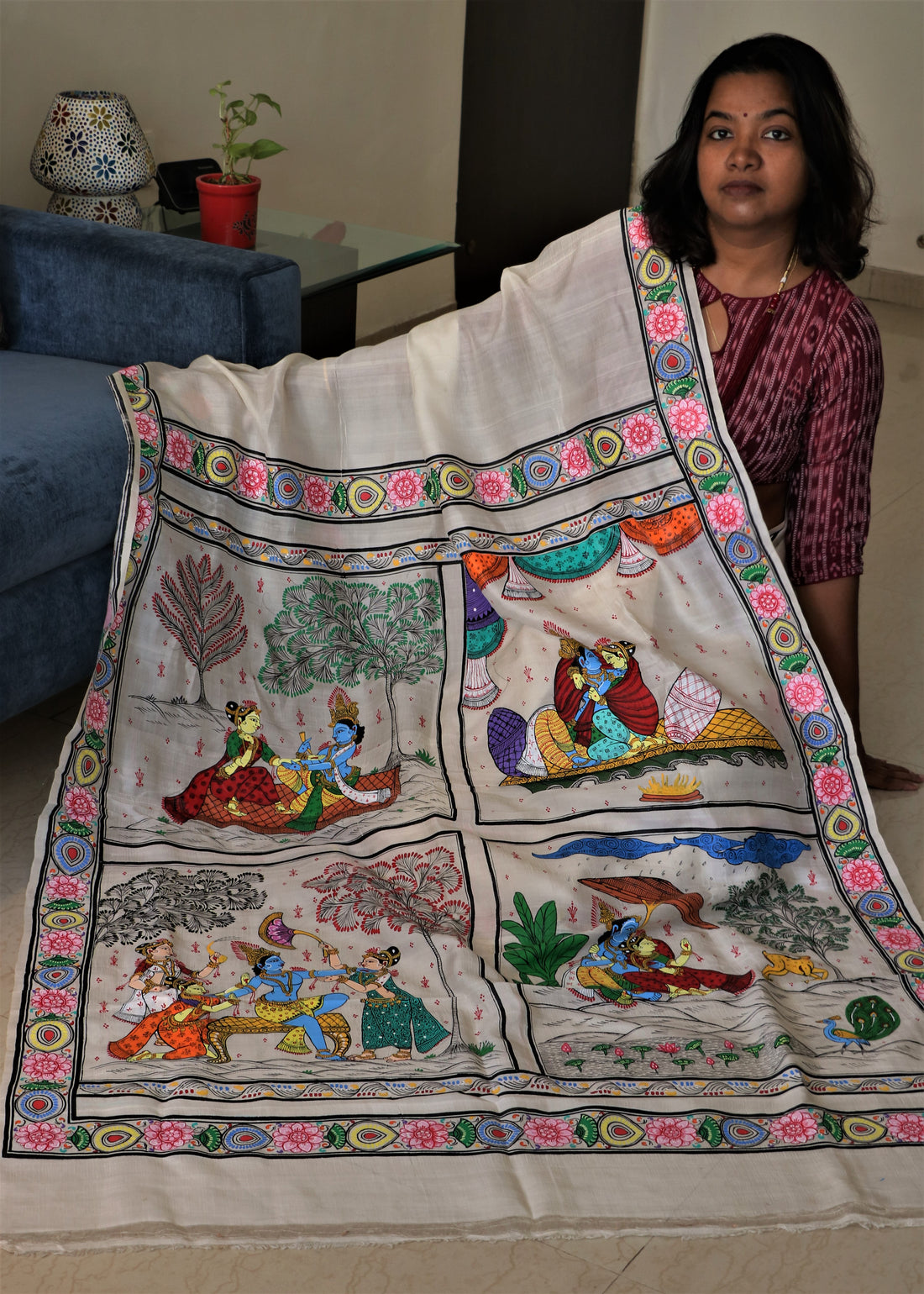 The saree is timeless Indian wear that has been reinvented and refashioned over the years. This is an upcycled silk saree hand-painted with Patachitra folk art making it a perfect example of slow sustainable fashion 