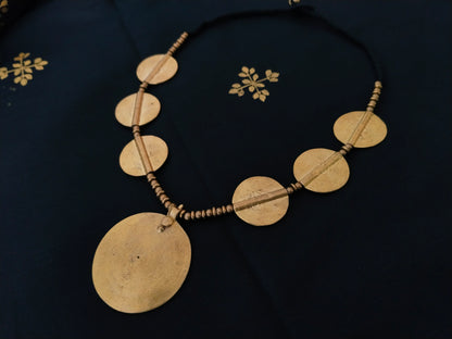Sun pendant with beads and small brass disks