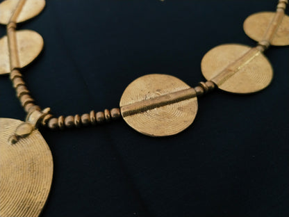 Sun pendant with beads and small brass disks